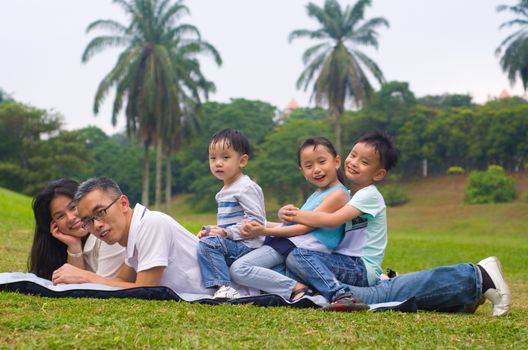 asian family having fun time at outdoor