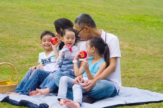 asian family having fun time at outdoor