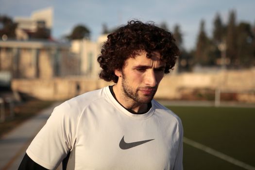 WEST BANK, Ramallah: Mohammed al-Khatib trains at a track field at a high school in Ramallah, West Bank, on December 16, 2015. Mohammed al-Khatib is a 25 years-old yoga and fitness instructor living in Ramallah, who is training for a chance to race in the 100-meter and 200-meter track at the 2016 Olympic Games in Brazil. He recently raised through crowdfunding over $12,000 in a few days to go train in the U.S. where he will participate to races in order to qualify.