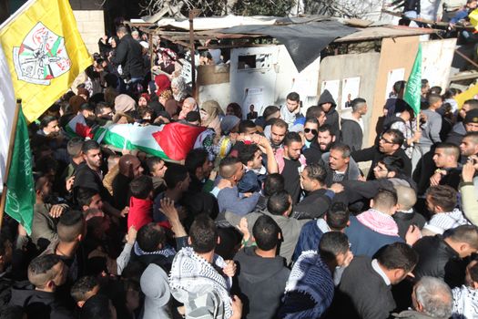 WEST BANK, Bethlehem: Palestinian mourners carry the body of a dead Palestinian man identified as Srur Ahmad Abu Srur, during his funeral ceremony at Aida refugee camp in Bethlehem, West Bank on January 13, 2016. The corpse was buried at Aida refugee camp a day after the Palestinian man was allegedly shot in the chest by Israeli forces in Beit Jala, a Palestinian health ministry statement said. 
