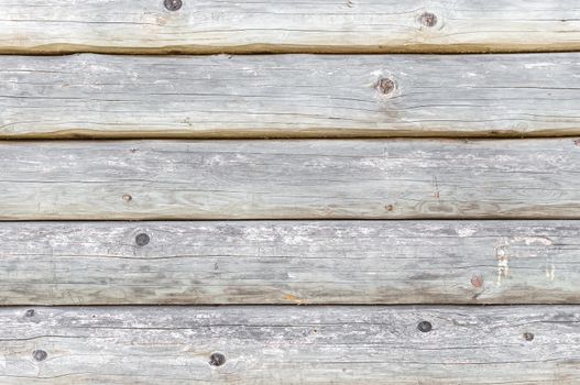 Old wooden wall made of logs as a background