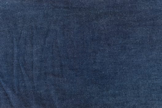 Close up of dark blue jeans texture for background