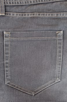 Empty pocket in dark grey jeans trousers