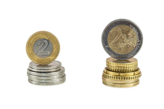 Stack of polish zloty and euro coins isolated on white background with clipping path