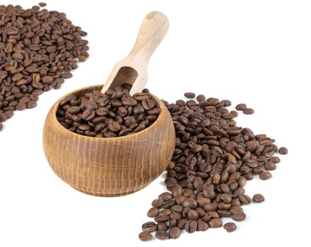 Coffee beans in bowl with wooden shovel isolated on white background