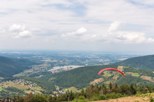 Paraglider in mountain range of Little Beskids