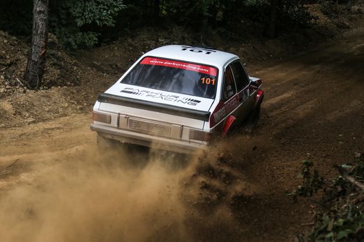 KOCAELI, TURKEY - AUGUST 23, 2015: Engin Kap with Ford Escort MK2 of Bonus Unifree Parkur Racing Team in Kocaeli Rally 2015
