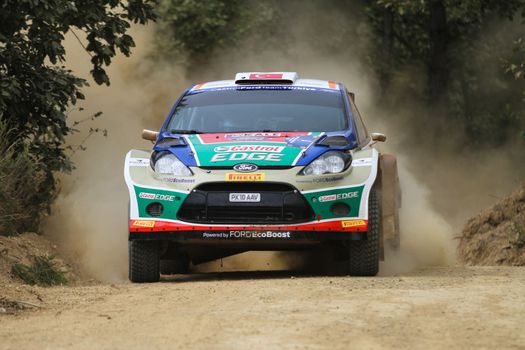 KOCAELI, TURKEY - AUGUST 22, 2015: Murat Bostanci with Ford Fiesta S2000 of Castrol Ford Team Turkiye in Kocaeli Rally 2015
