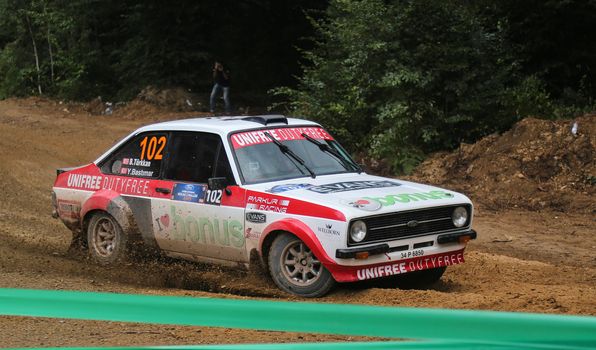 KOCAELI, TURKEY - AUGUST 23, 2015: Burak Turkkan with Ford Escort MK2 of Bonus Unifree Parkur Racing Team in Kocaeli Rally 2015