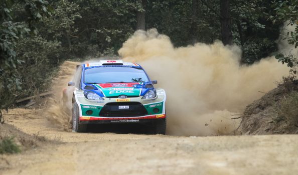 KOCAELI, TURKEY - AUGUST 22, 2015: Orhan Avcioglu with Ford Fiesta S2000 of Castrol Ford Team Turkiye in Kocaeli Rally 2015