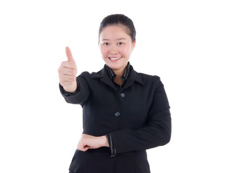 An Asian girl giving thumb up sign on white background