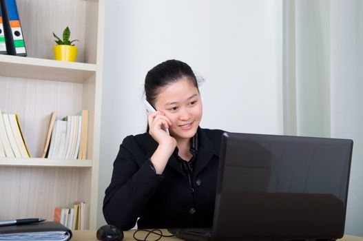 Beautiful asia young business woman with headset and laktop