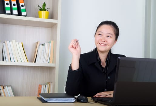 Young business women working with laktop ,having thought.