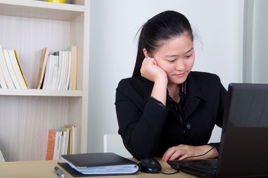 young business woman thinking in the office