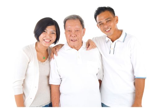 Senior man with his daughter and son. Happy Asian family senior father and adult offspring indoor portrait.