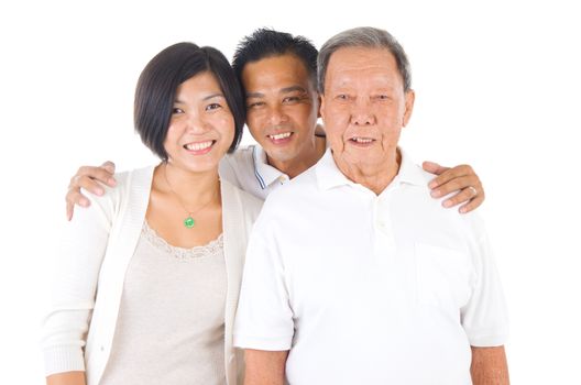 Senior man with his daughter and son. Happy Asian family senior father and adult offspring indoor portrait.