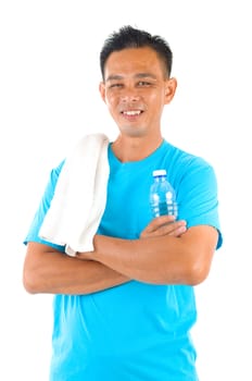 Southeast Asian fitness man  holding water bottle and towel after training isolated on white background.