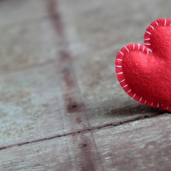 Red Valentine heart on wood background, one lonely heart in Valentine day, a special day for couple on feb 14, a abstract concept for love