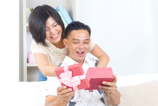 Asian girl surprises his boyfriend with a gift