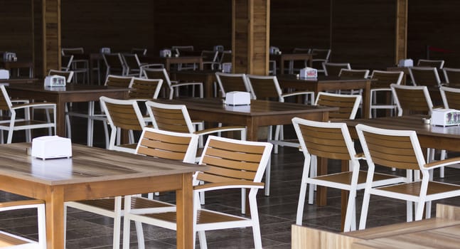 Chairs and tables in the empty restaurant