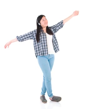 Young woman with headphones listening music and dancing