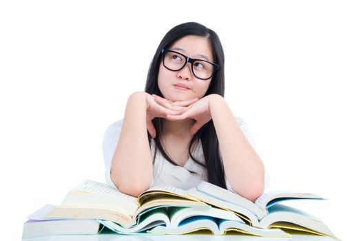 Asian young student girl thinking with book over white background