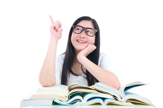 Asian young student girl thinking with book over white background