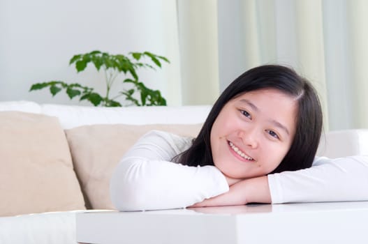 Portrait of attractive Asian girl smiling. Young woman indoors living lifestyle at home.