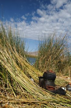 Island, sky, birds on Titicaca lake trip in Peru