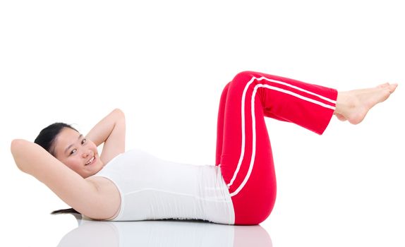 Woman doing abdominal crunches on exercise