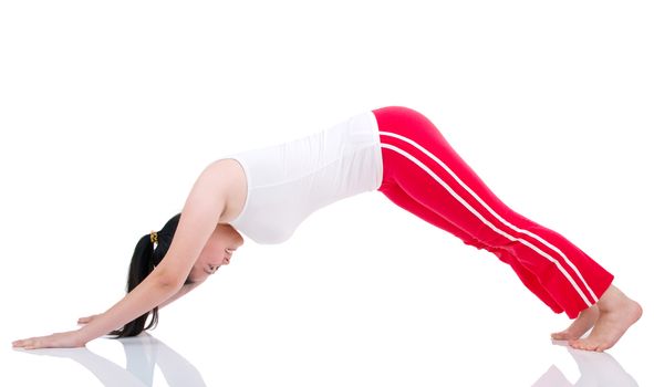 beautiful young woman stretching on the floor