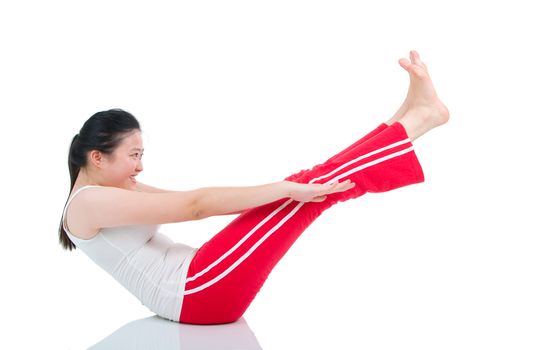 Woman doing abdominal crunches on exercise