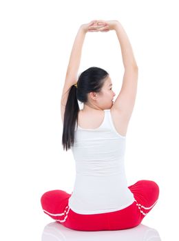 Beautiful fit woman stretching her arm and smiling