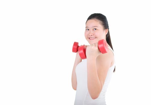 smiling woman working out with dumbbells in her hands