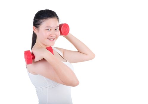 smiling woman working out with dumbbells in her hands