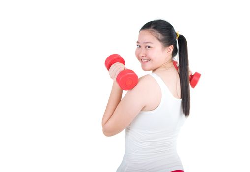 smiling woman working out with dumbbells in her hands