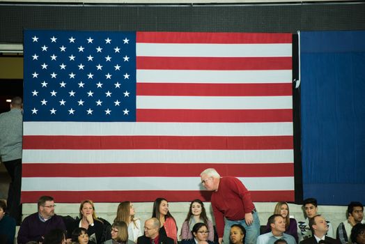 UNITED STATES, Omaha: The American flag is pictured during President Obama's speech at UNO's Baxter Arena in Omaha, Nebraska on January 13, 2016, one day after his final State of the Union address.