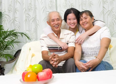 Indoor portrait of asian family