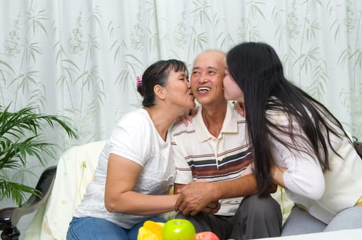 Indoor portrait of asian family