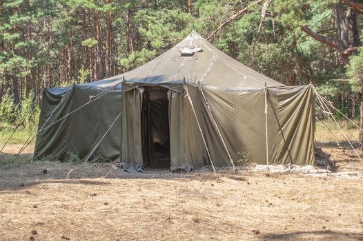 Green tent with tent camping, camping in the woods