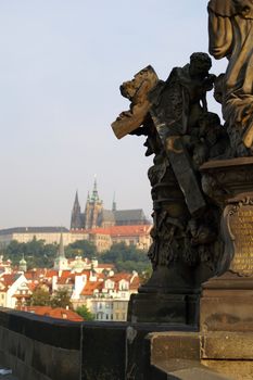 Statues of Charles bridge  and barocco churches - beautiful scene in old prague city