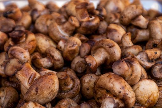 it is a lot of tasty fried mushrooms of shampyon a grill