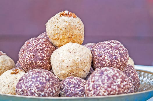 it is a lot of tasty multi-colored sweet balls with sesame