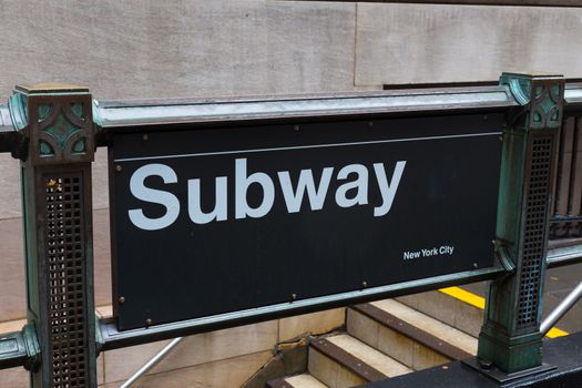 New York City subway sign on station entrance.