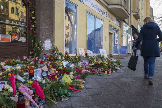 GERMANY, Berlin : Fans pay their respects bringing their tributes to British rock icon David Bowie outside his former home in Hauptstrasse 155 in Berlin on January 14, 2016.David Bowie, who died of cancer on January 10, 2016, lived 1976-1978 in Berlin Schoeneberg in the Hauptstrasse 155.  
