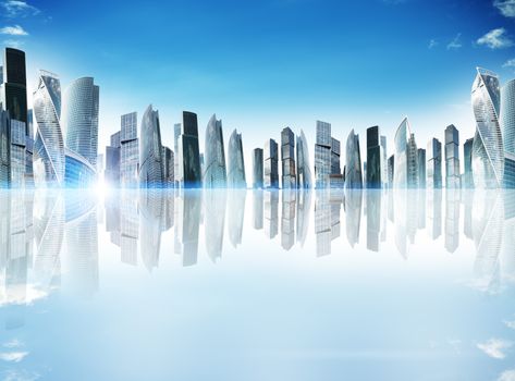 City with reflection and blue sky with clouds and spotlight