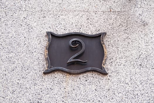 The metal plate with the house number 2