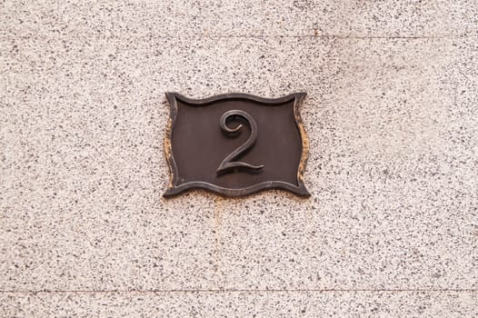 The metal plate with the house number 2