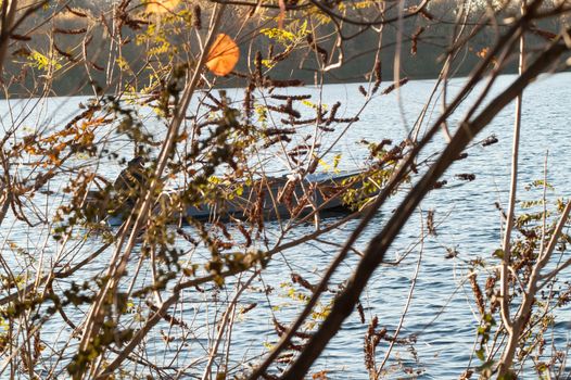 Sailing boat in the water at the autumn fishing