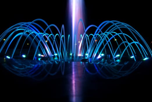 Close view details of the fountain at night, blue lighting decoration